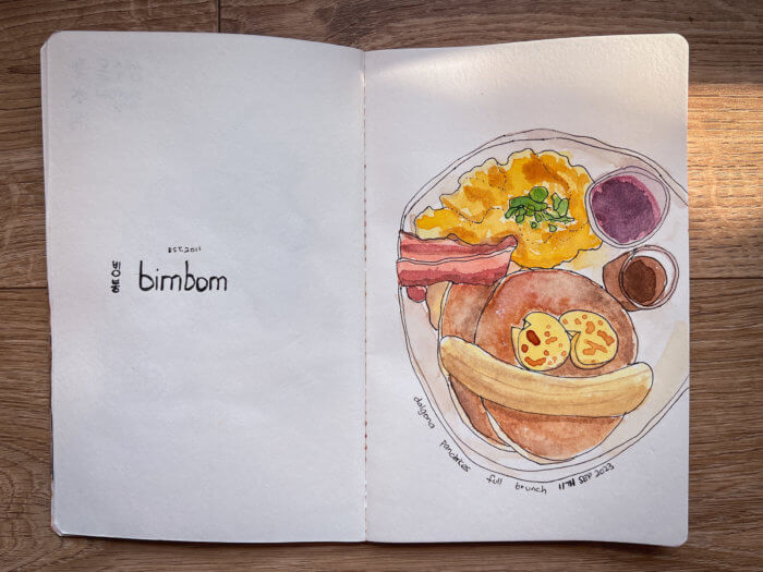 photo of my sketchbook displaying a painting of some brunch food from seoul