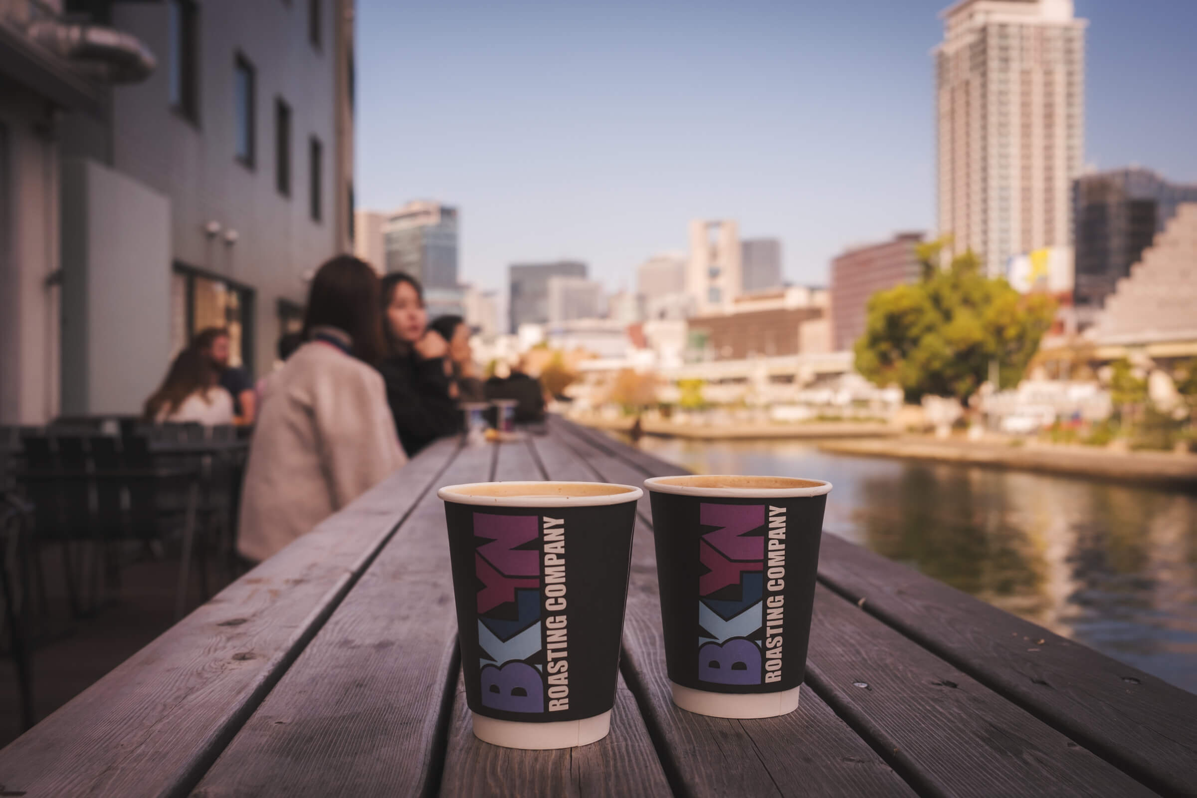 photo of coffee by the riverside