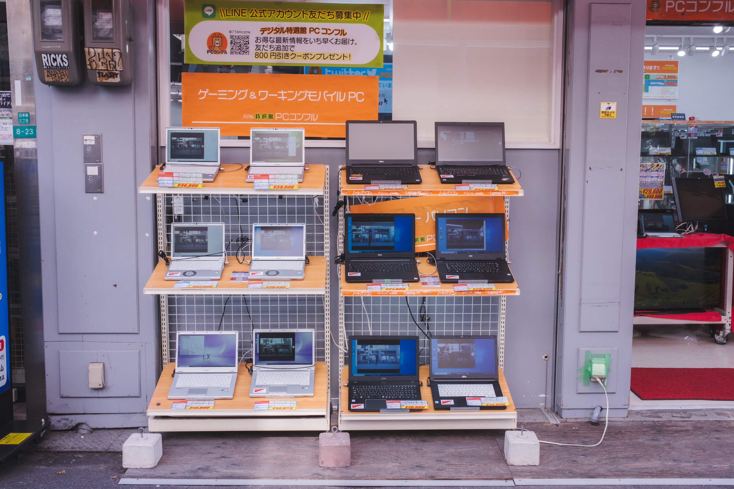 photo of used laptops being displayed outdoors