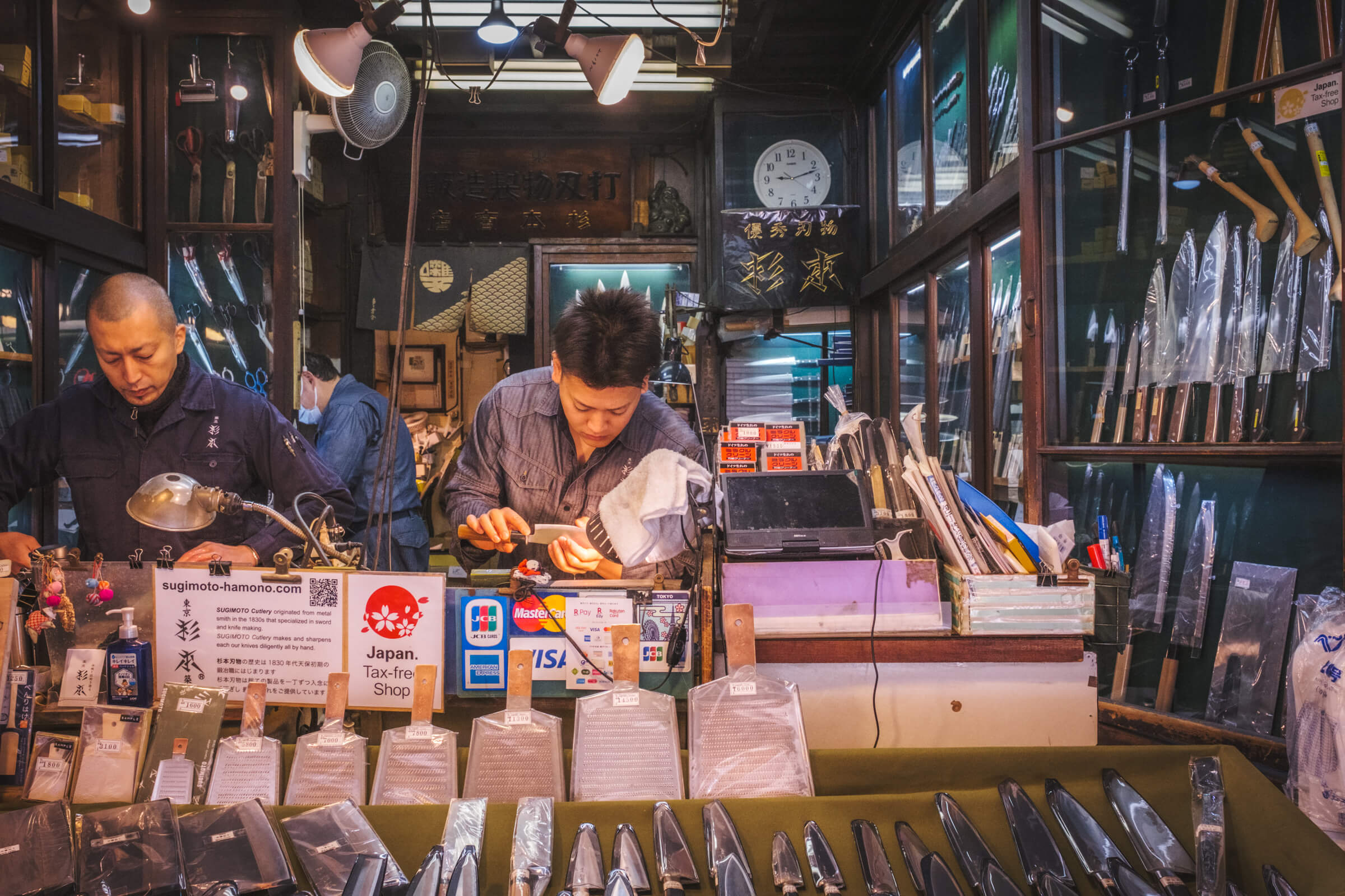 photo of someone sharpening a knife