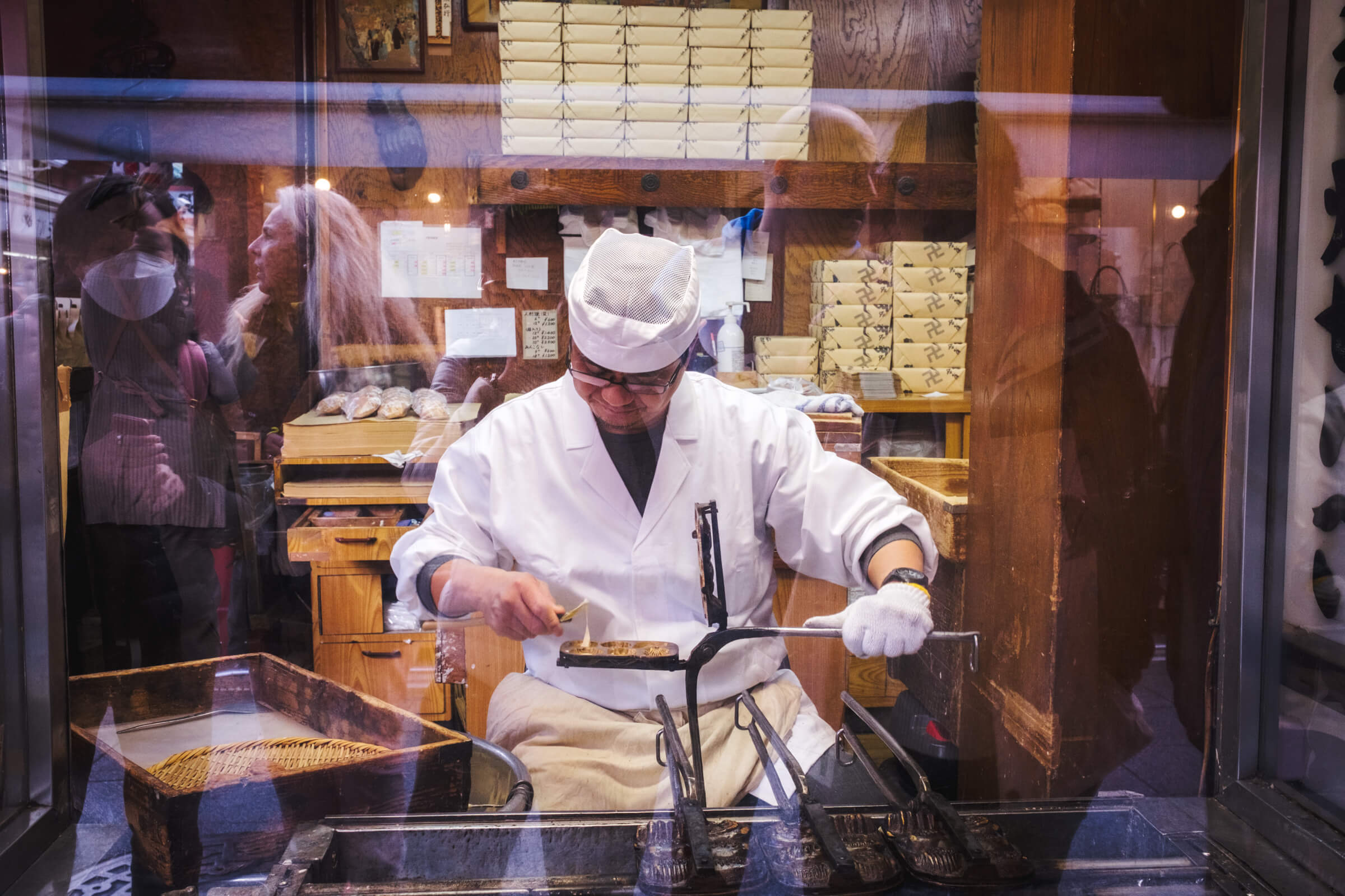 photo of someone making japanese pancake