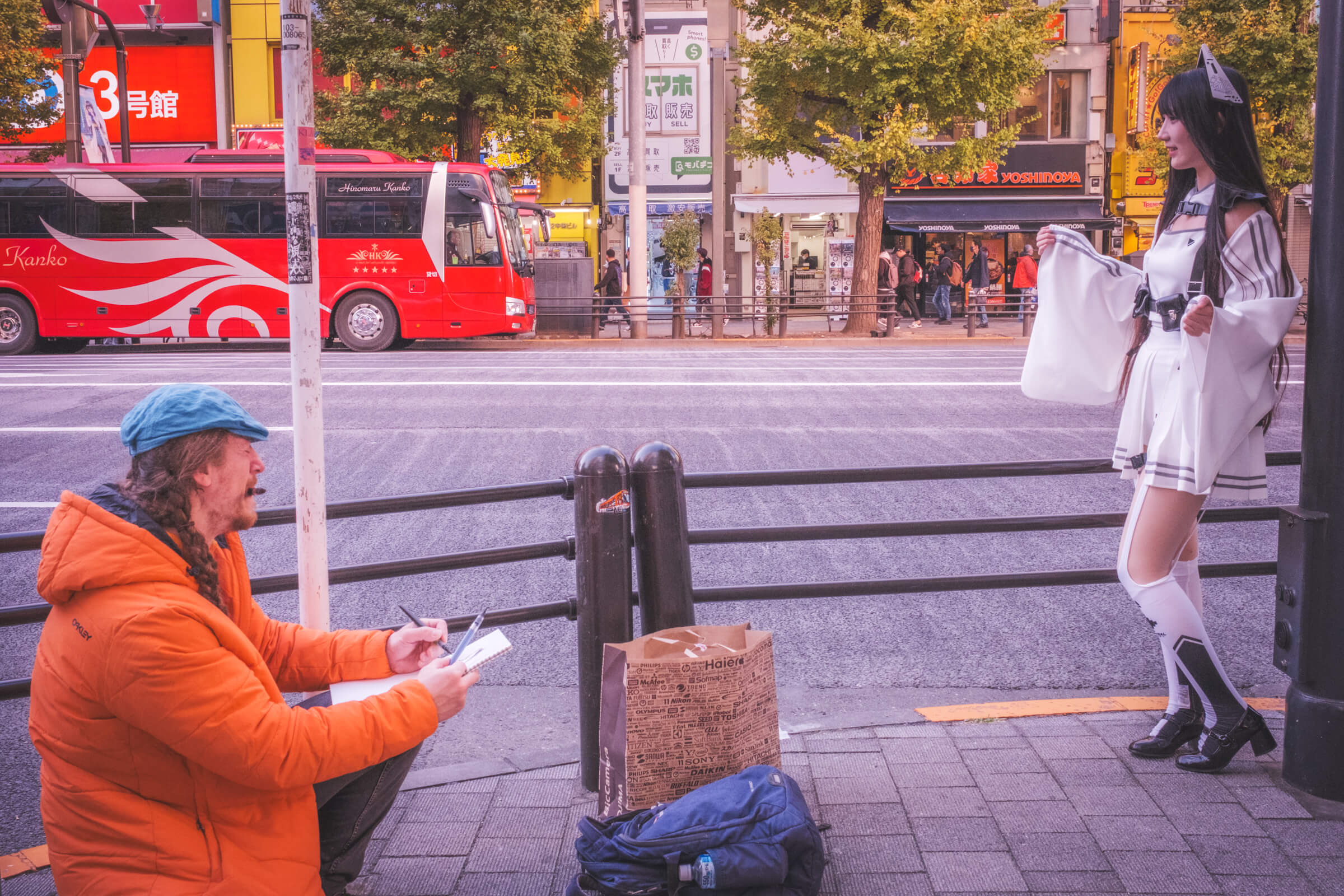 photo of someone live drawing a person in cosplay