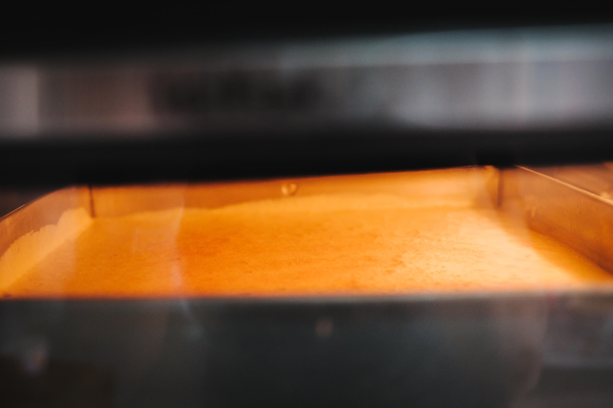 photo of the cake baking in the oven