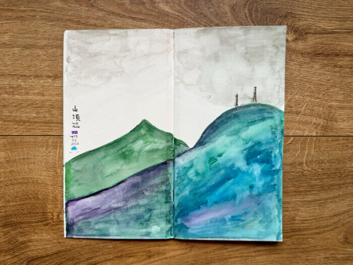 photo of a painting of The Peak, hong kong in my sketchbook