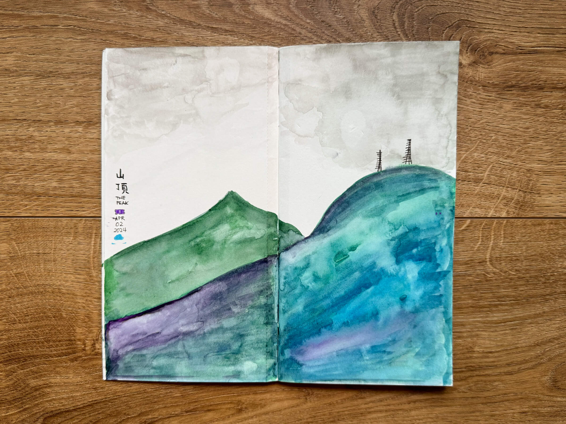 photo of a painting of The Peak, hong kong in my sketchbook