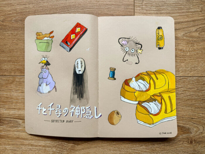 photo of a sketchbook spread with objects and characters from "spirited away"