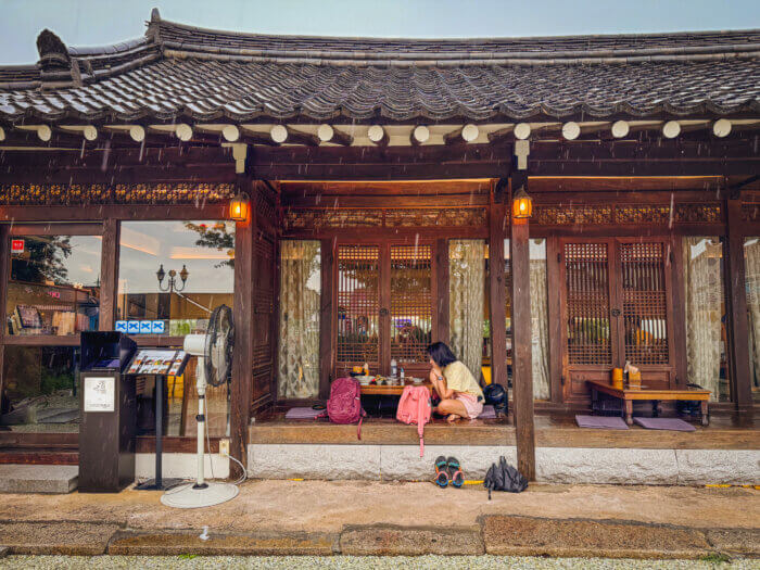 photo of my partner at a restaurant with beautiful outdoor sitting