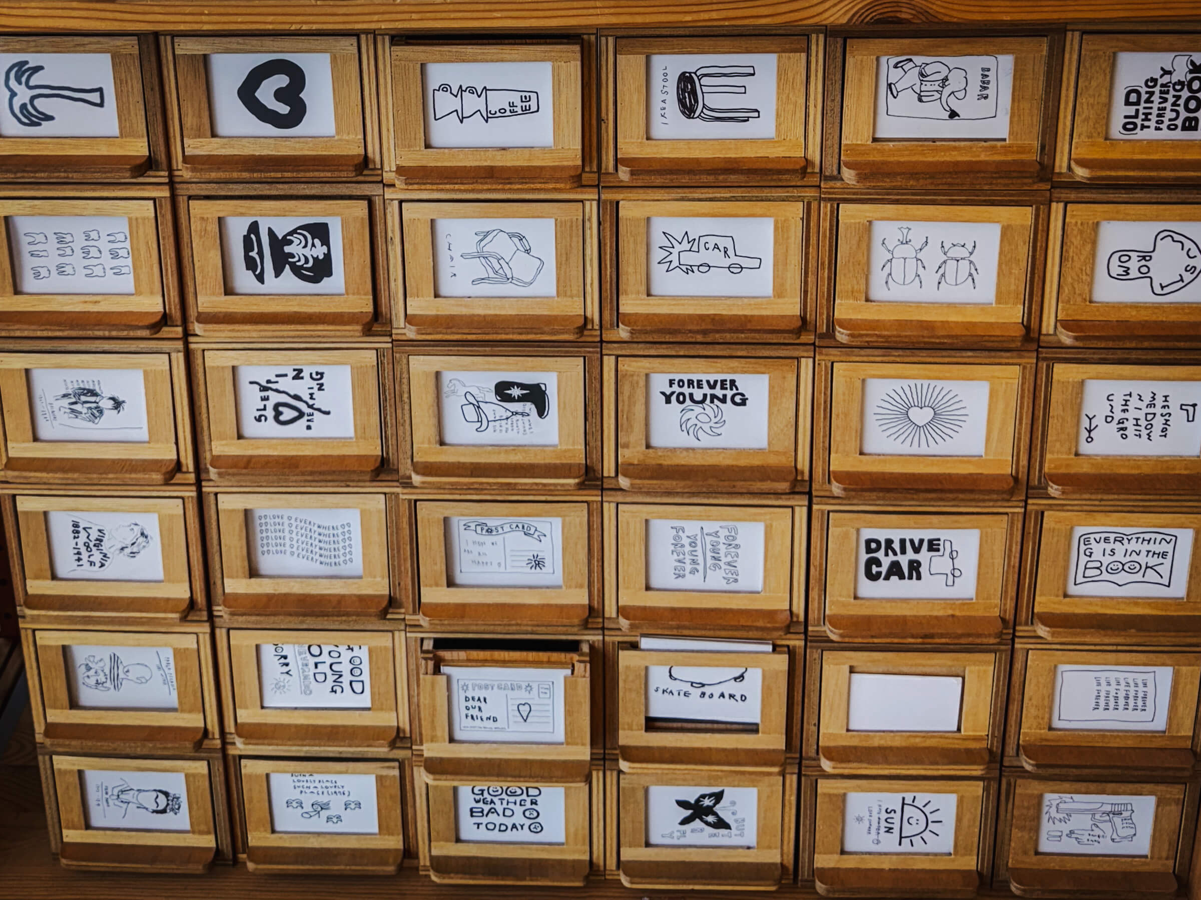 photo of shelves of stickers in a stationery store, Object