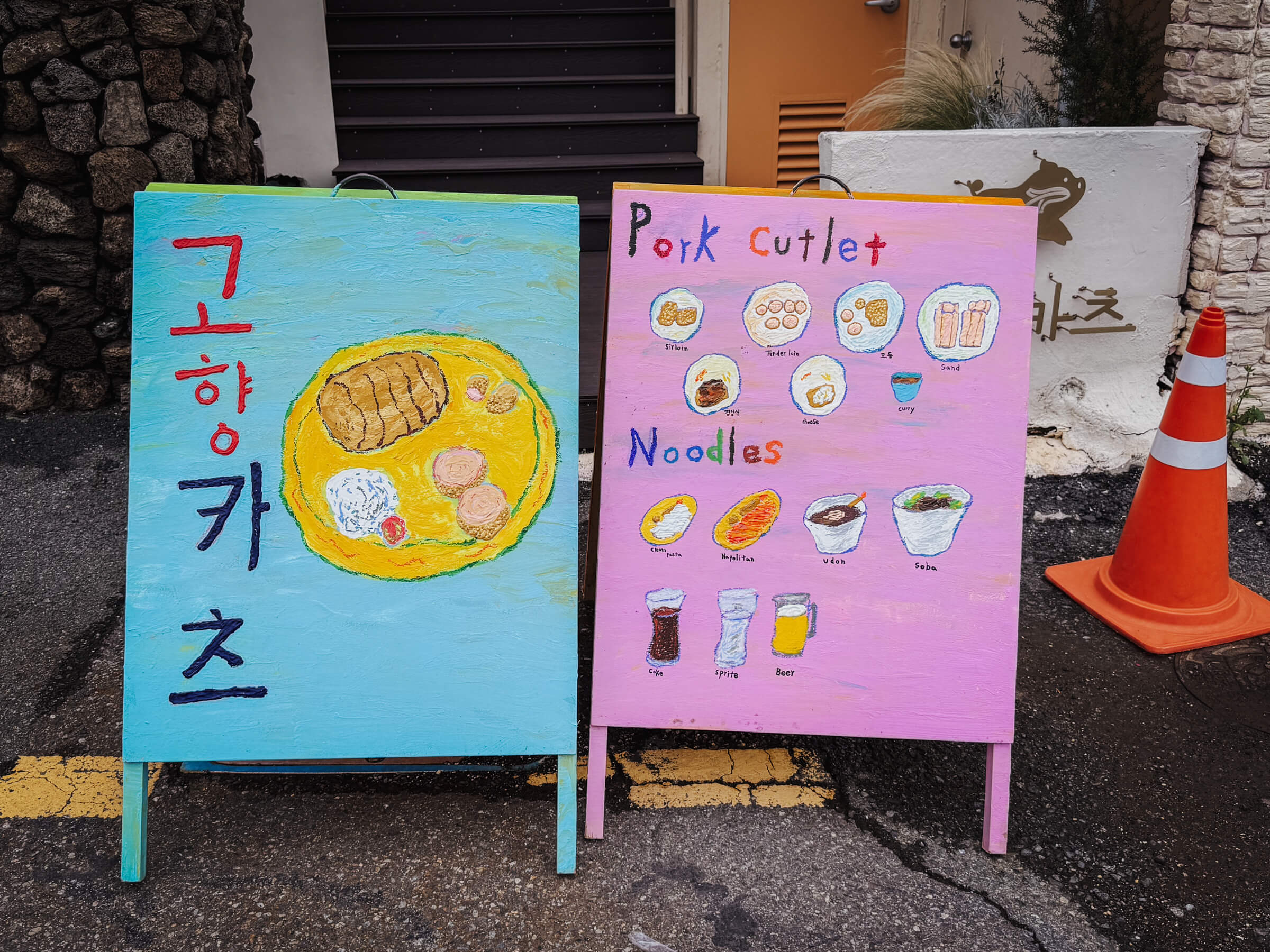 photo of a hand-painted restaurant signboard and menu