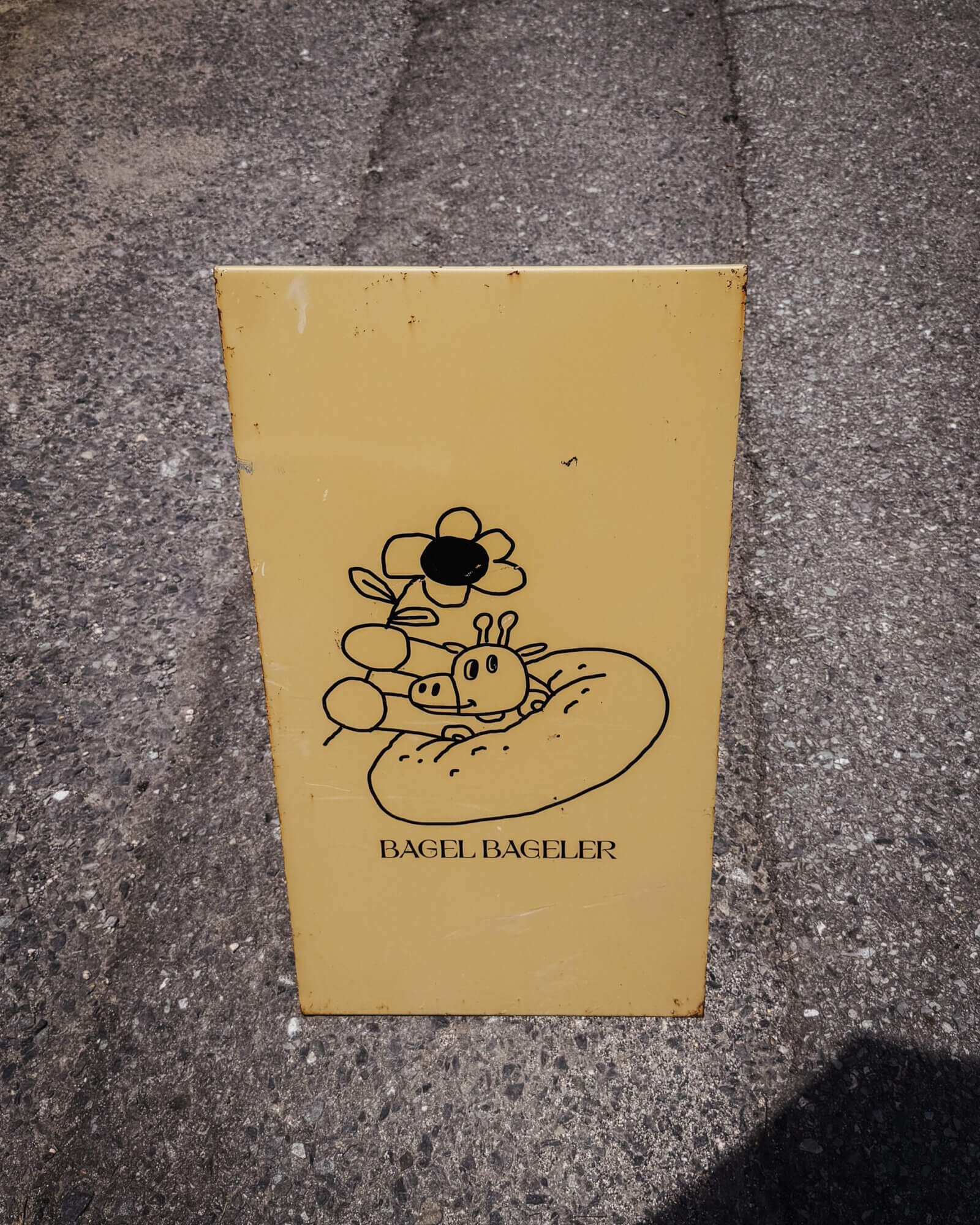 photo of a signboard from bagel bageler
