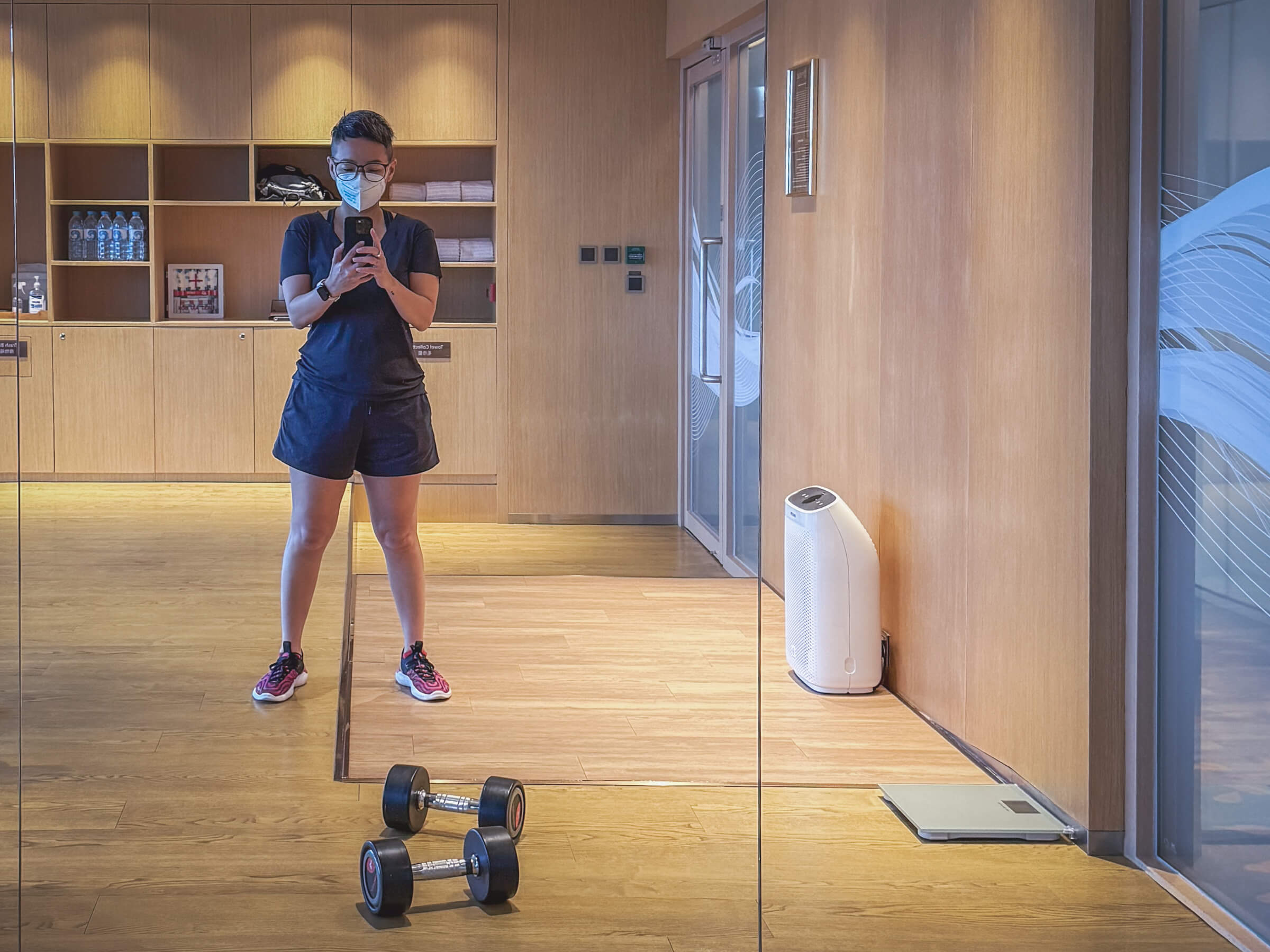 photo of me with dumbbells in a gym in hong kong