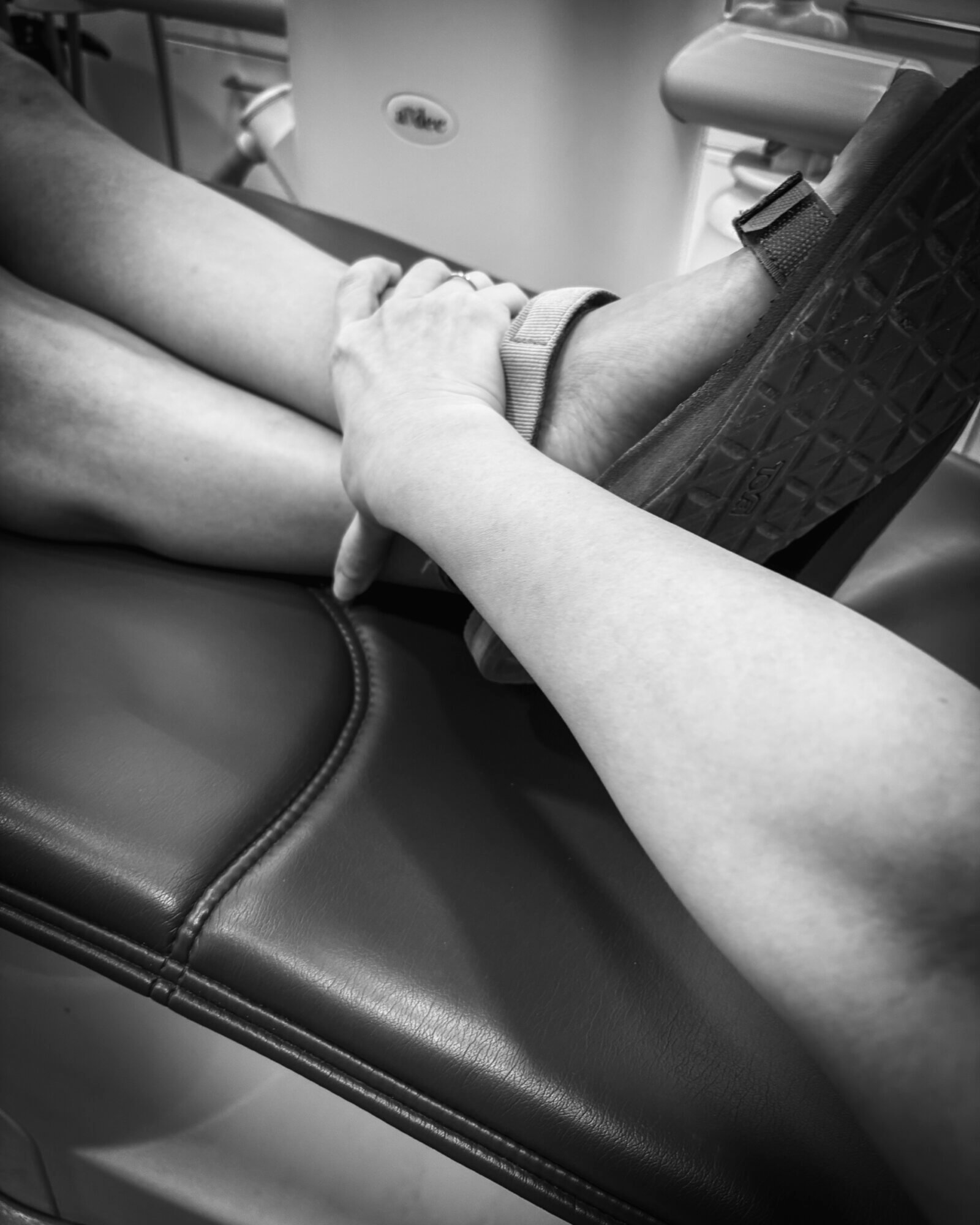 photo of my partner holding my leg during my root canal