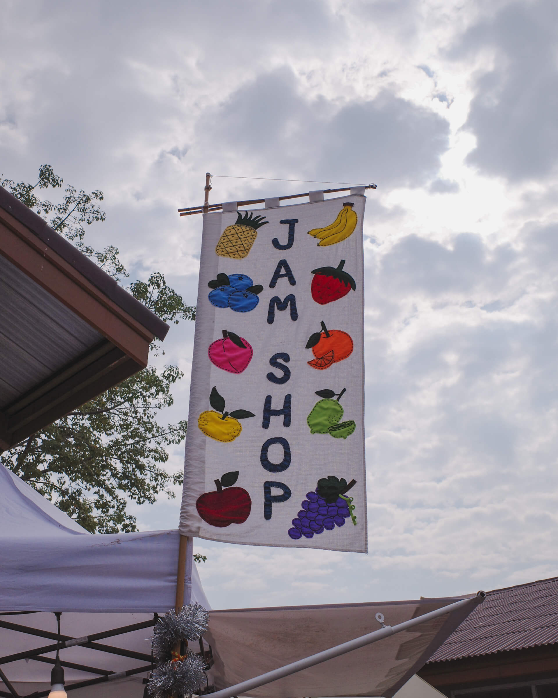 sewn signage of a jam shop
