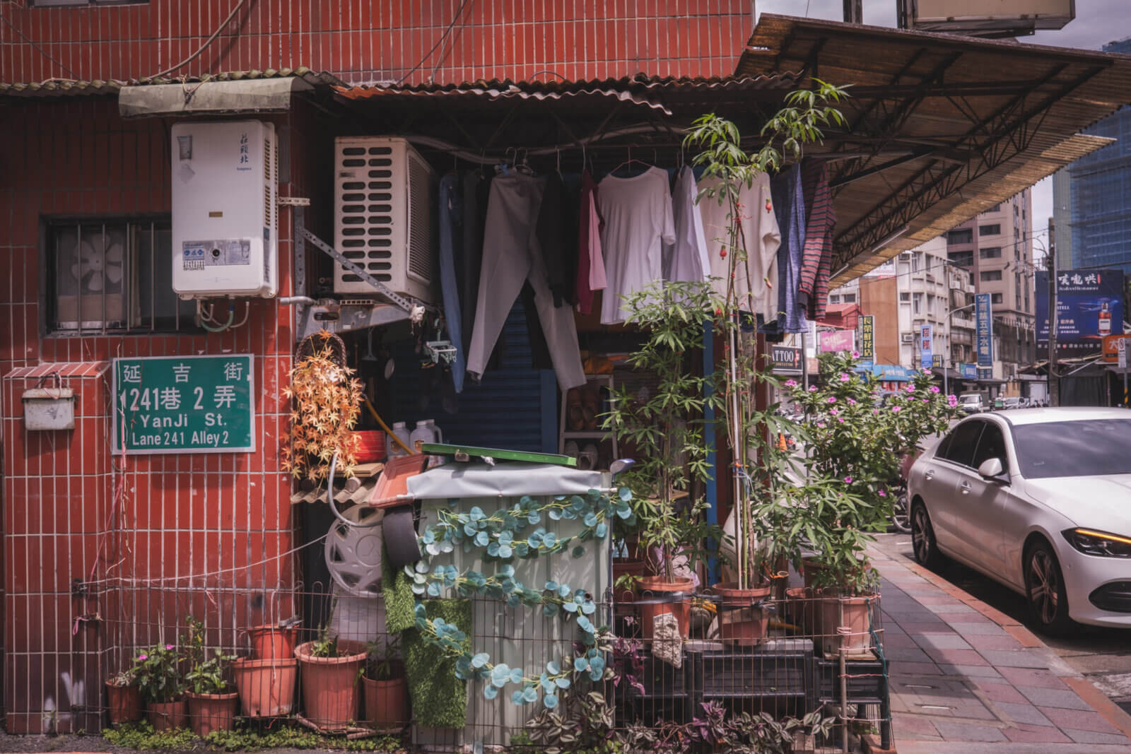 photo of some laundry hanging in front of a house
