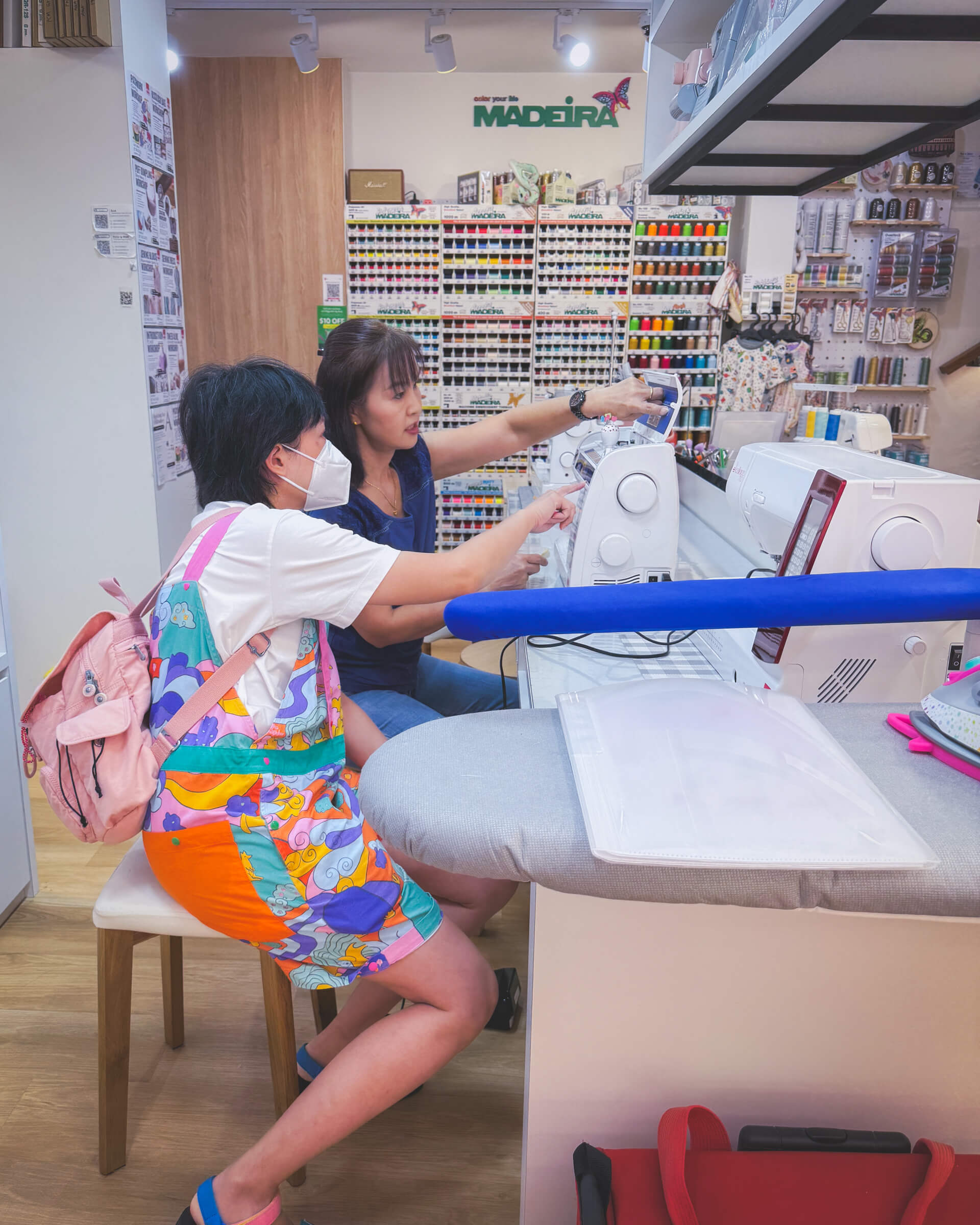 photo of my partner looking at sewing machines