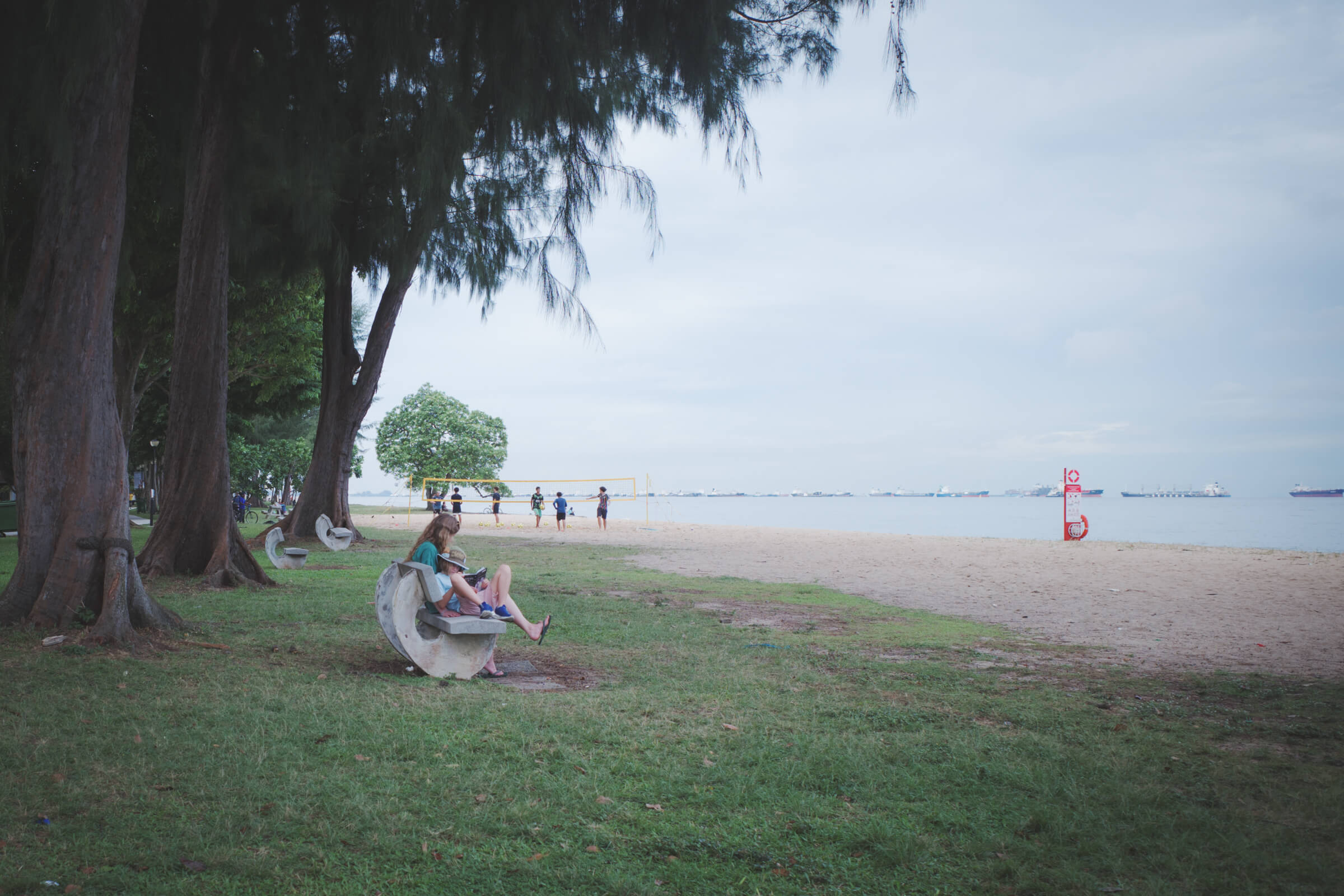 photo of mother and child at the beach