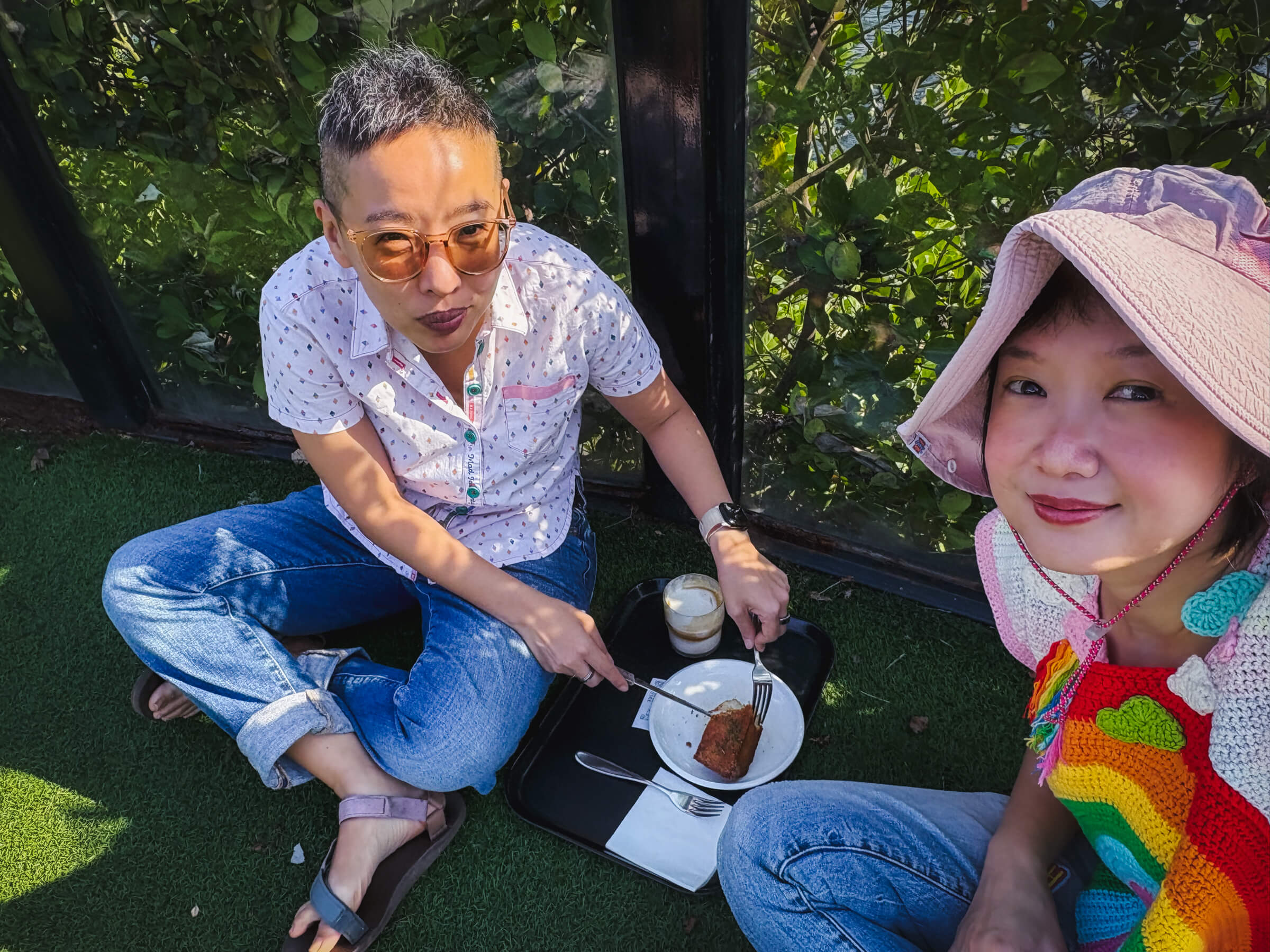 photo of us having a pastry and some coffee while seated on the floor of the patio because it was too hot and we can't eat indoors